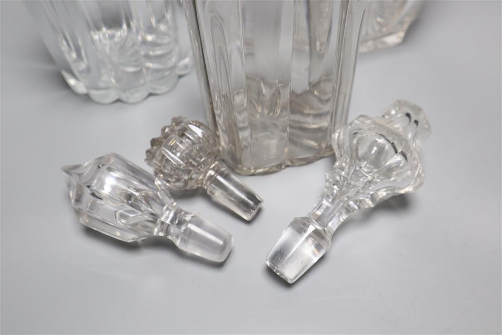 A Victorian cut glass claret jug and two decanters, tallest 34cm